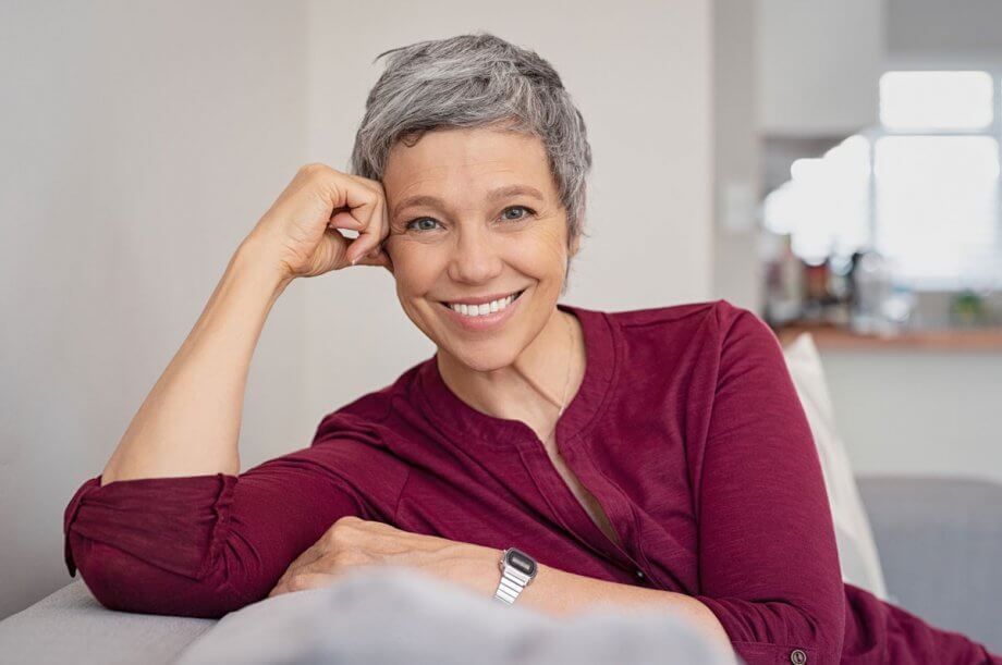 woman smiles in living room