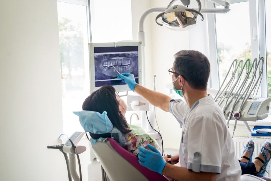 Dental Patient Being Shown XRays At Regular Dental Visit